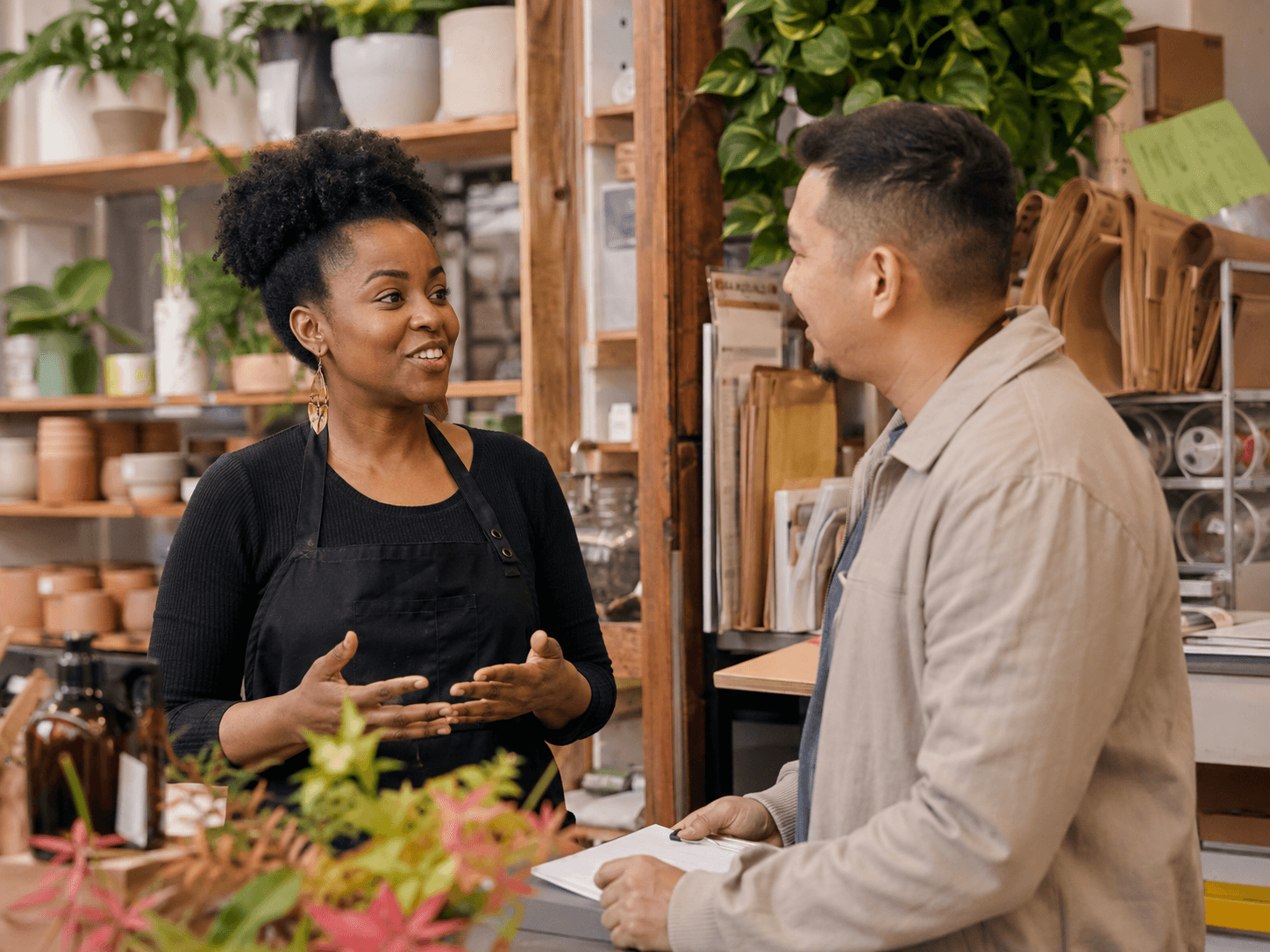 Local business owner discussing partnership in her shop.
